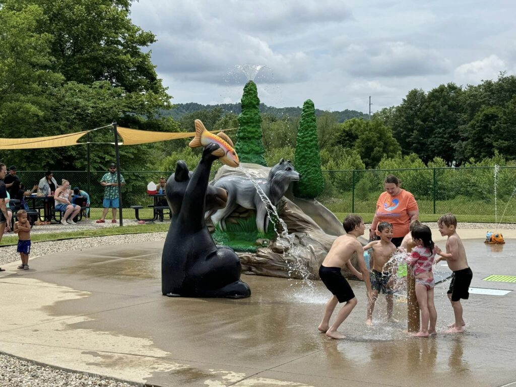 children playing at bear water feature